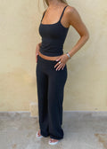 Model wearing wide leg pants in dark blue